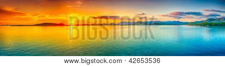 Picture or Photo of Sunrise over the sea.  Panorama