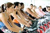 image of fitness  - Group Of People Cycling In A Gym - JPG 