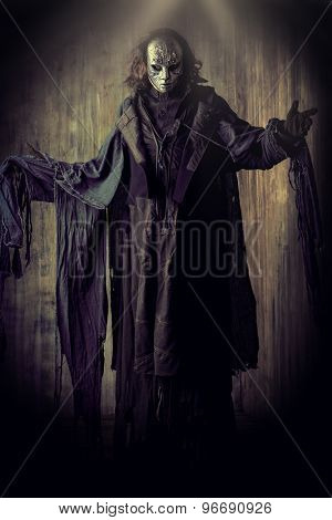 scary man in iron mask and black robe fantasy halloween poster