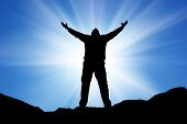 picture of religion  - Silhouette of man and sunshine on sky background - JPG 
