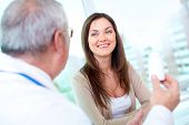 picture of medical doctors  - Portrait of pretty patient listening to mature practitioner in hospital - JPG 