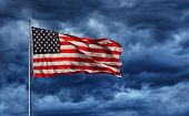 stock photo of unite  - Majestic United States Flag against a dark background - JPG 