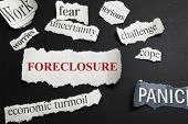 image of newspaper  - Newspaper headlines showing Foreclosure and bad economic news - JPG 
