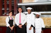 pic of restaurant  - four friendly restaurant staff in restaurant kitchen - JPG 