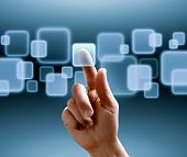 pic of future  - hand pushing a button on a touch screen interface - JPG 