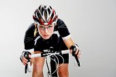 image of fitness  - Road bicycle woman riding her bike and concentrating on winning the cycle race - JPG 