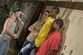 stock photo of pressure  - Tough guys at school hanging around the locker - JPG 