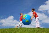 picture of globe  - Mother with  son play an inflatable globe in  day - JPG 