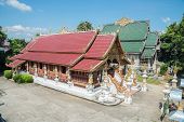 Wat Ming Muang a beautiful temple in Chiang rai province of Thailand from high angle view.