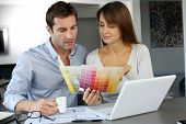 image of home  - Couple choosing paint colour for their new home - JPG 