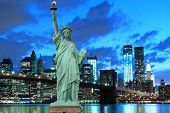 stock photo of bridge  - Brooklyn Bridge and The Statue of Liberty at Night - JPG 