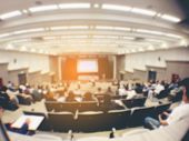 Blurred Image Of Business Conference And Presentation. People Meeting Conference Seminar, Audience A
