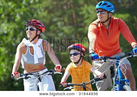Picture or Photo of Portrait of happy family riding on bicycles at leisure