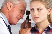 picture of md  - Doctor Examining Teenage Girl - JPG 