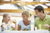 image of family  - Family Having Lunch Together At The Mall - JPG 