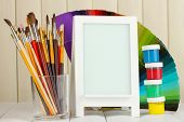 stock photo of  photo  - Photo frame as easel with artist - JPG 