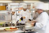 foto of restaurant  - Busy chefs at work in the restaurant kitchen - JPG 