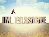 stock photo of possibility  - man jump over possible word - JPG 