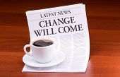 stock photo of newspaper  - The newspaper LATEST NEWS
with the headline CHANGE WILL COME on table - JPG 