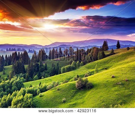 Picture or Photo of Majestic sunset in the mountains landscape. Overcast sky before storm. Carpathian, Ukraine, Europe. Beauty world.