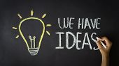 stock photo of leadership  - Person drawing a We Have Ideas Diagram with chalk on a blackboard - JPG 