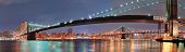 picture of bridge  - New York City Manhattan Bridge and Brooklyn Bridge with downtown skyline panorama over East River at night - JPG 