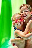 stock photo of holidays  - Child on water slide at aquapark - JPG 