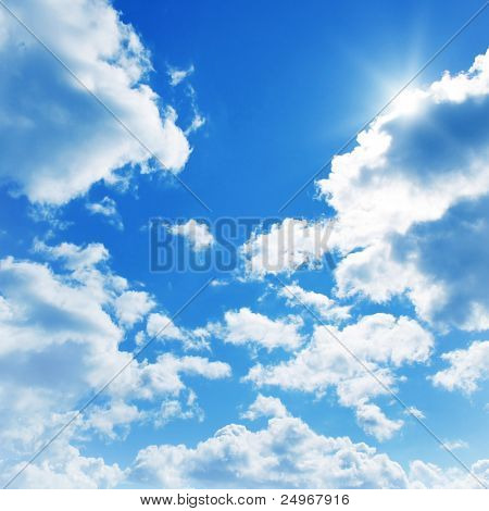 Picture or Photo of Blue sky with clouds and sun.
