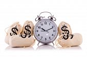 stock photo of money  - Sacks of money and alarm clock on white - JPG 