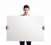 pic of young adult  - Portrait of a young man showing an empty billboard on white background - JPG 