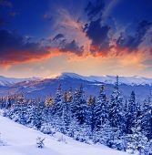 pic of sunset  - majestic sunset in the winter mountains landscape - JPG 