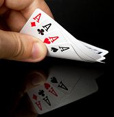 picture of competition  - Four aces in the hand with reflection - JPG 