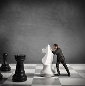 picture of strategy  - Concept of Strategy of a businessman on a chesswoard - JPG 