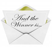 stock photo of competition  - An opening envelope revealing a card containing the name of the award winner - JPG 