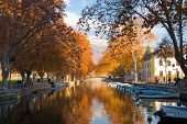 picture of france  - The canal in Annecy France ringed by the beautifully colored autumn leaves - JPG 